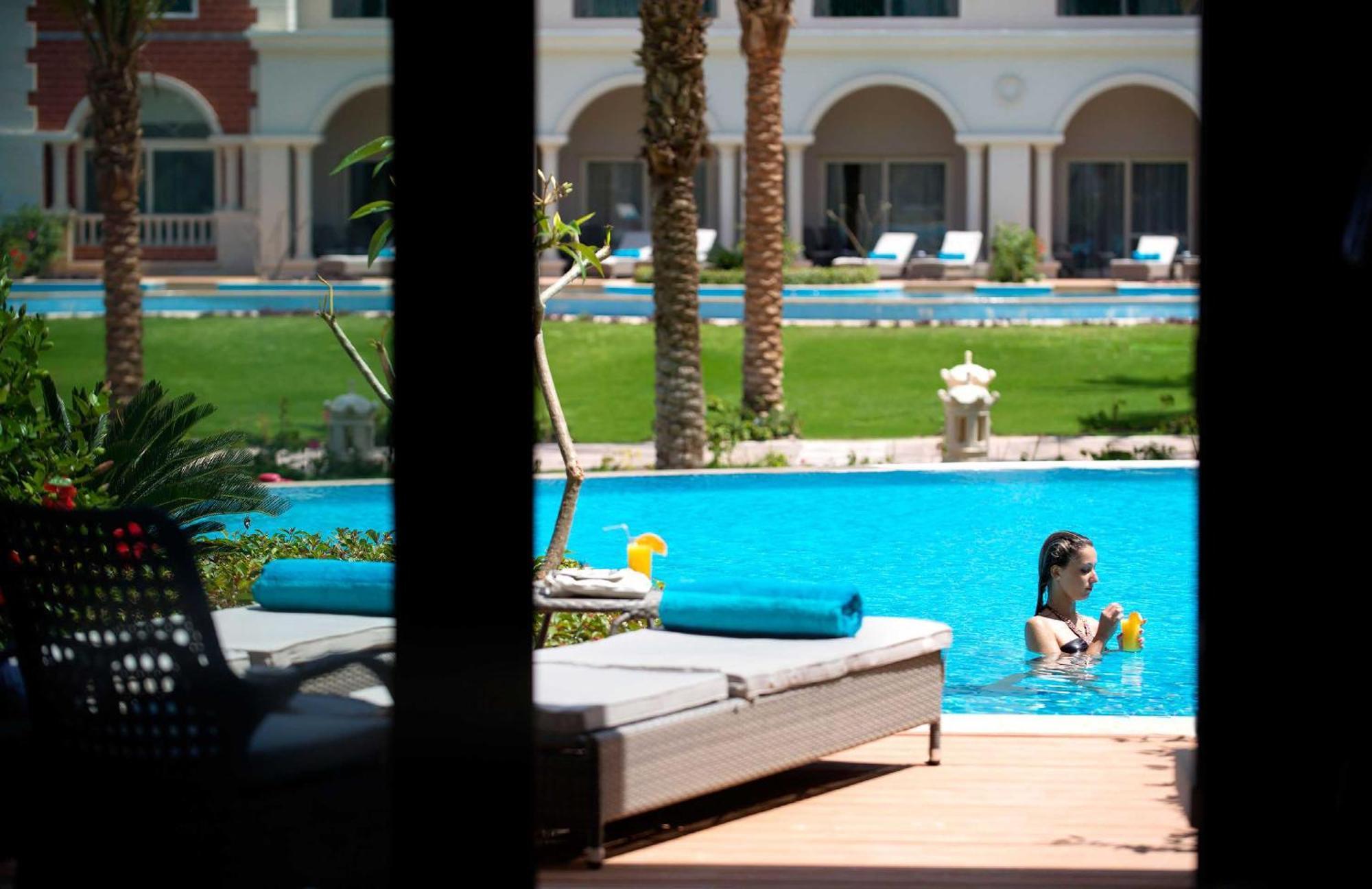 Baron Palace Sahl Hasheesh Hurghada Exterior foto The swimming pool at the hotel
